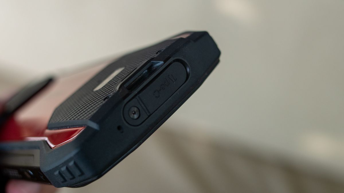 Ulefone Armor 15 charging port covered by a rubber flap