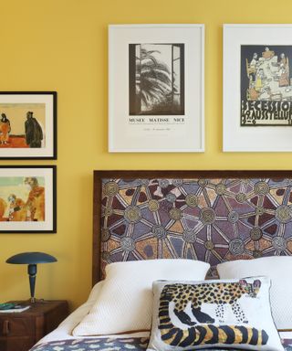 Yellow painted bedroom in Sophie Ashby' London apartment