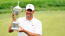 Lucas Glover celebrates with the winner's trophy after his two-stroke victory at the 109th U.S. Open on the Black Course at Bethpage State Park on June 22, 2009 in Farmingdale, New York.
