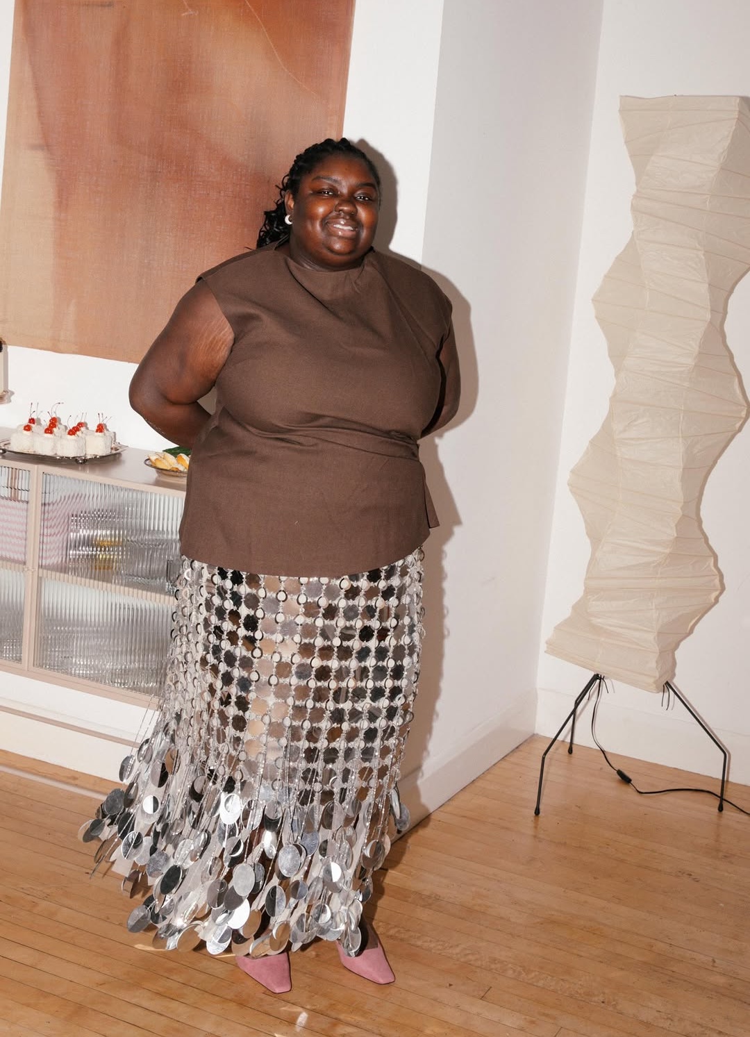 Abisola in a metallic disc silver skirt