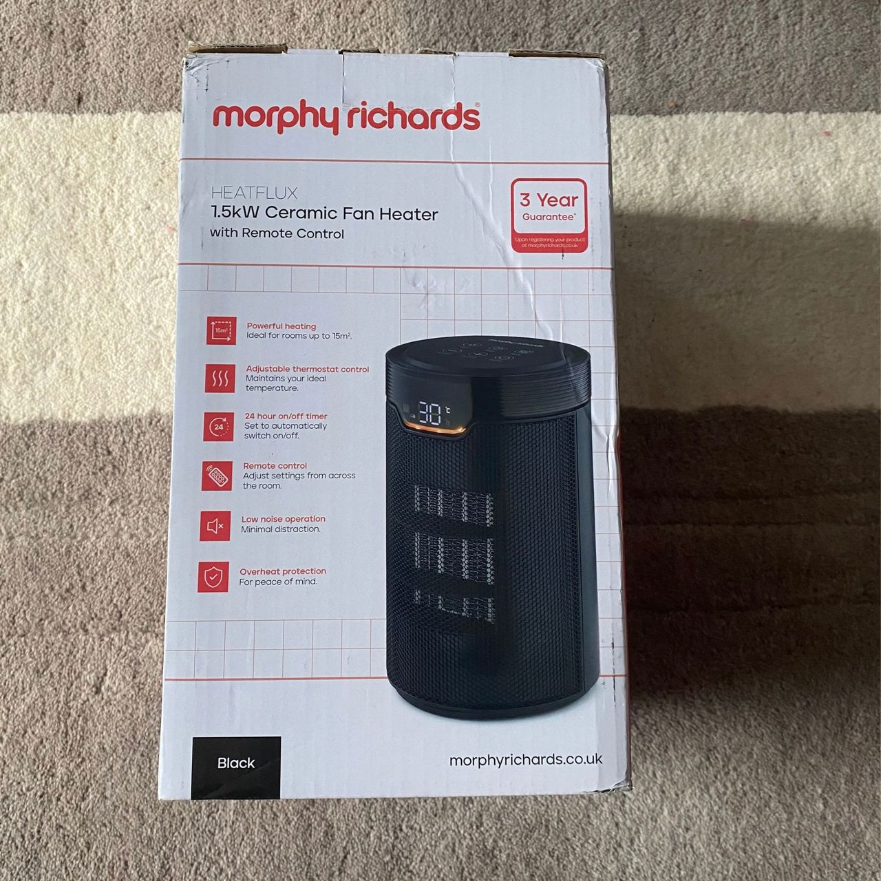 Outer packaging of the Morphy Richards HeatFlux 1.5kW Ceramic Fan Heater on a neutral rug