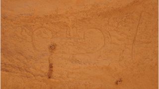 Rock art drawings of a boat found in the desert of Sudan.