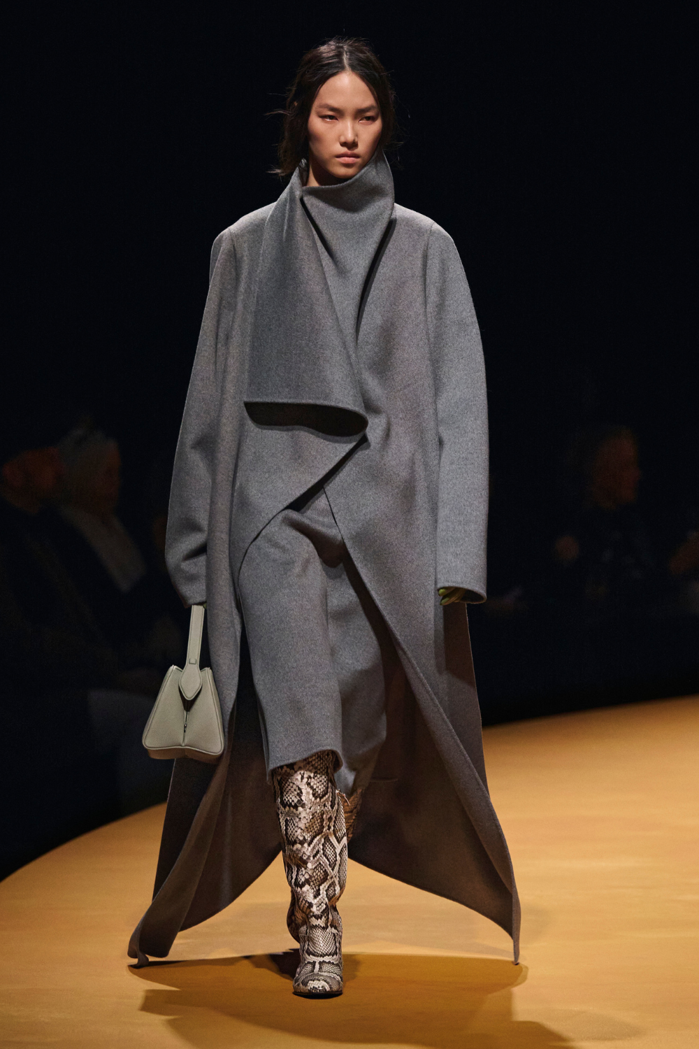 Khaite Autumn/Winter 25 catwalk grey dress, grey coat, snake print boots