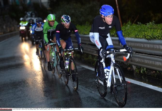 The break of the day on the dark wet roads of the 2014 Milan-San Remo