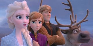 Elsa, Anna, Kristoff and Sven looking into the distance.