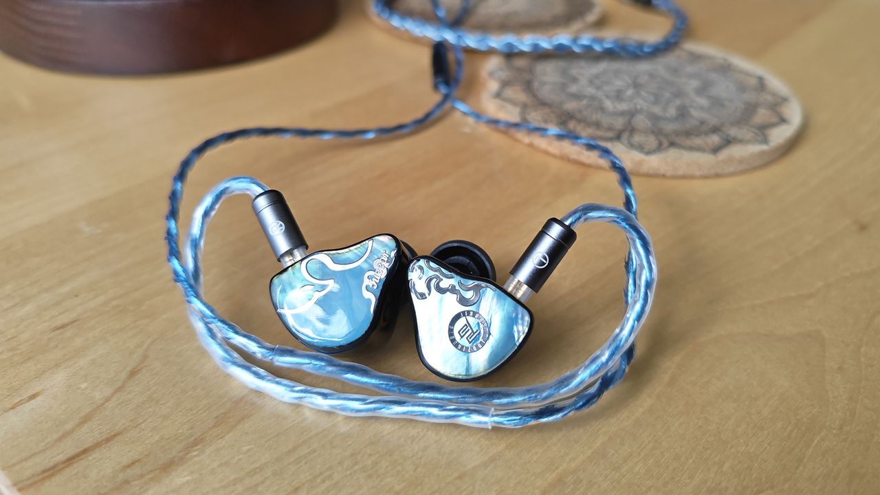 Three photos of the Juzear Defiant IEM.