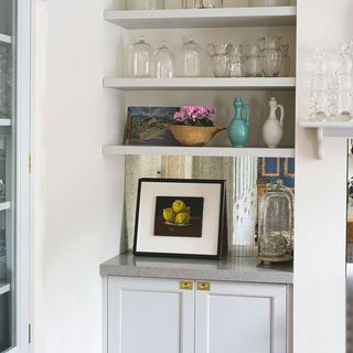 kitchen storage with white wall and frame
