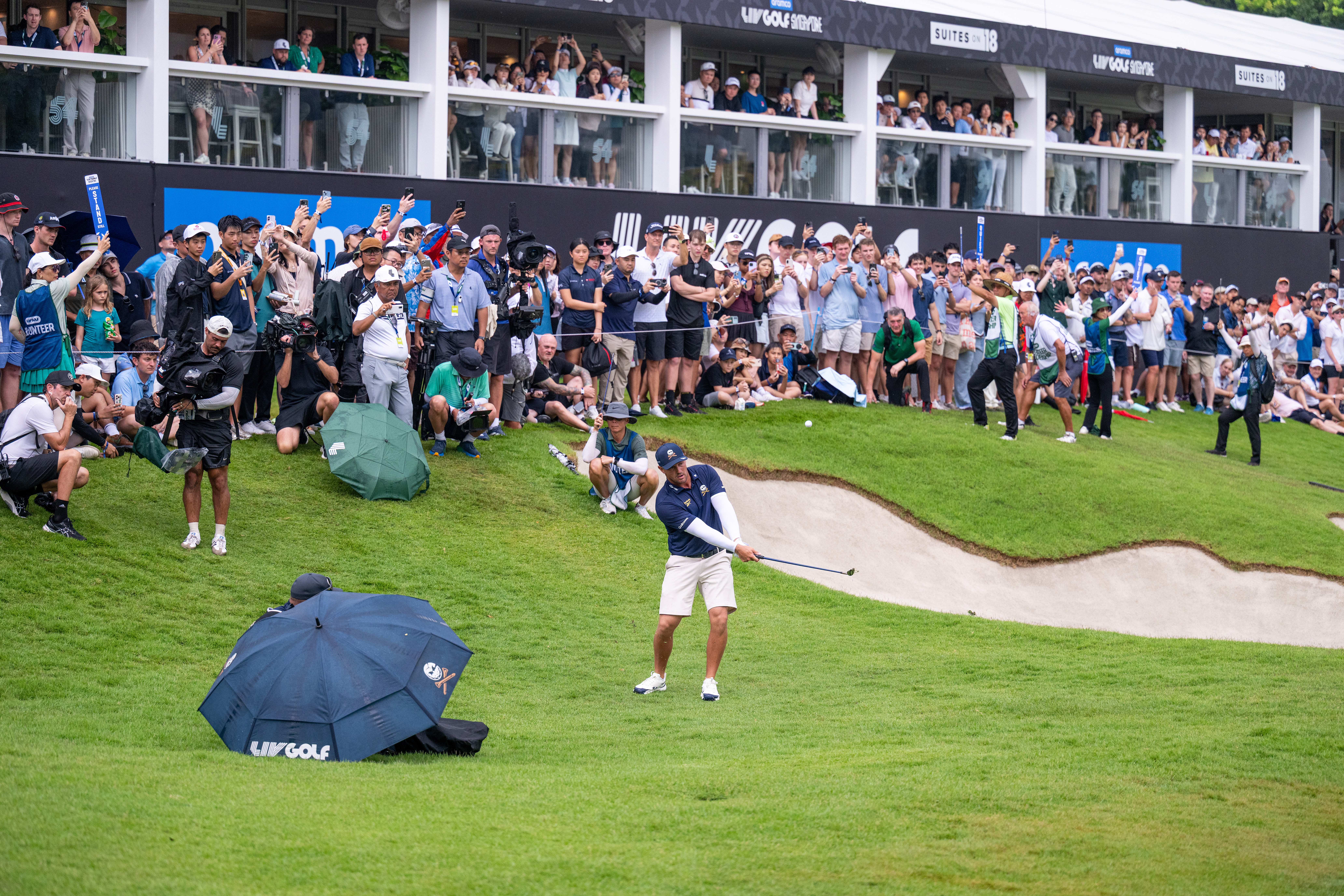 Bryson DeChambeau wedge shot greenside at LIV Golf Singapore