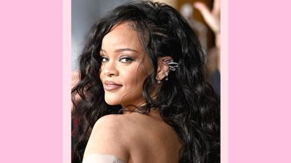 Rihanna pictured with curly hair and wearing a grey dress as she attends Marvel Studios' "Black Panther 2: Wakanda Forever" Premiere at Dolby Theatre on October 26, 2022 in Hollywood, California/ in a pink template