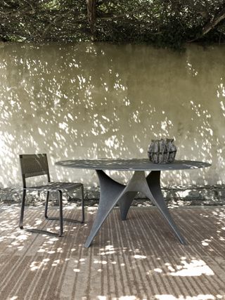 Arc table and outdoor rug