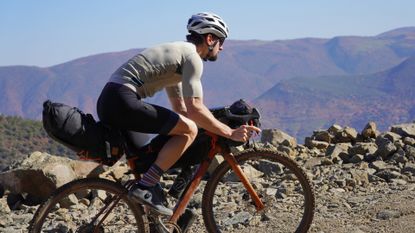 Male cyclist wearing gravel clothing