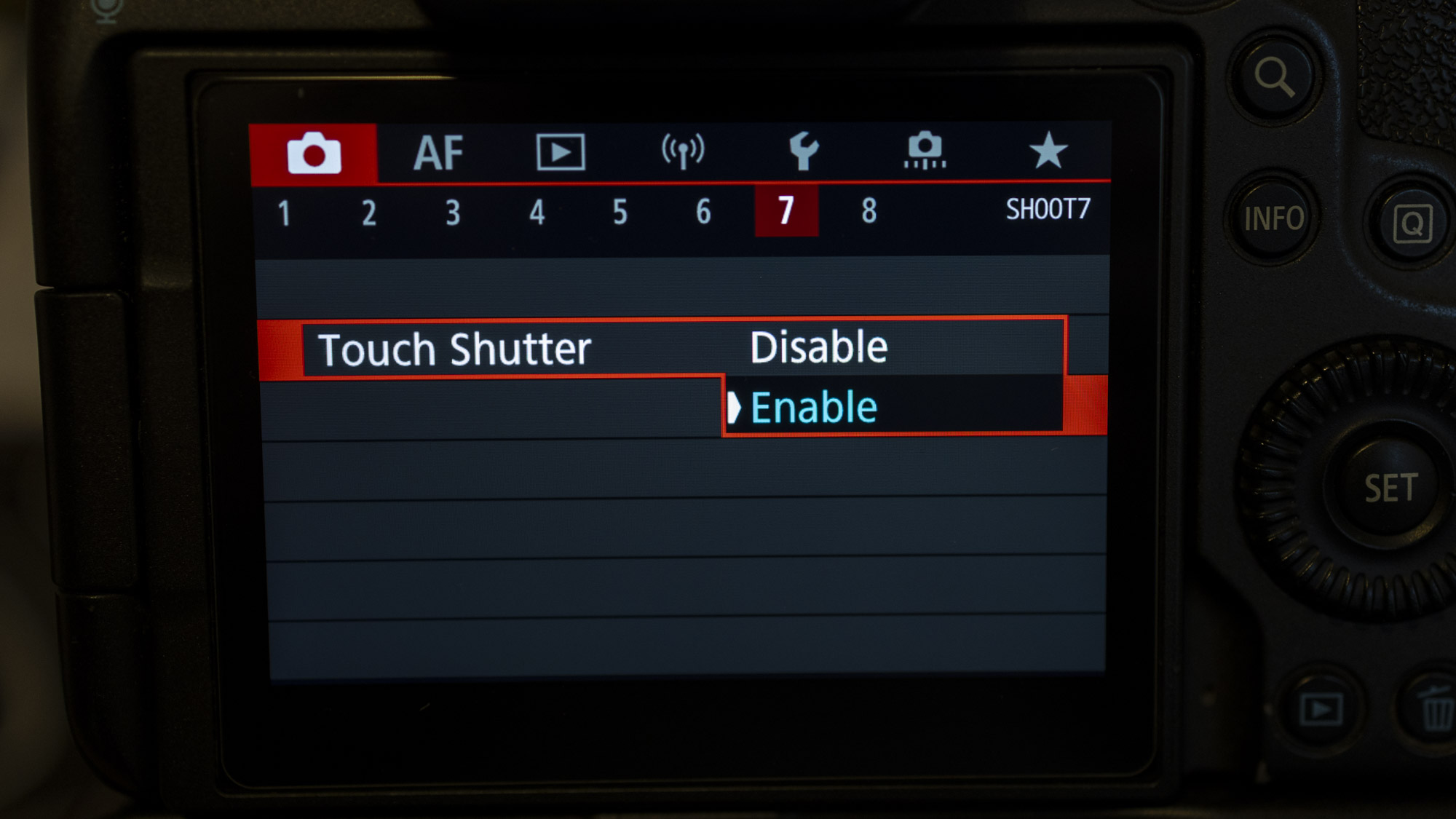 Back of a Canon EOS R5 camera showing the Touch Shutter settings in the Canon Menu