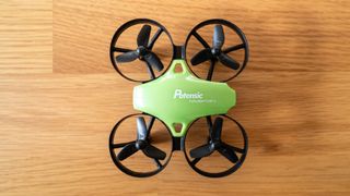 Potensic A20 Mini Drone from above on a wooden table