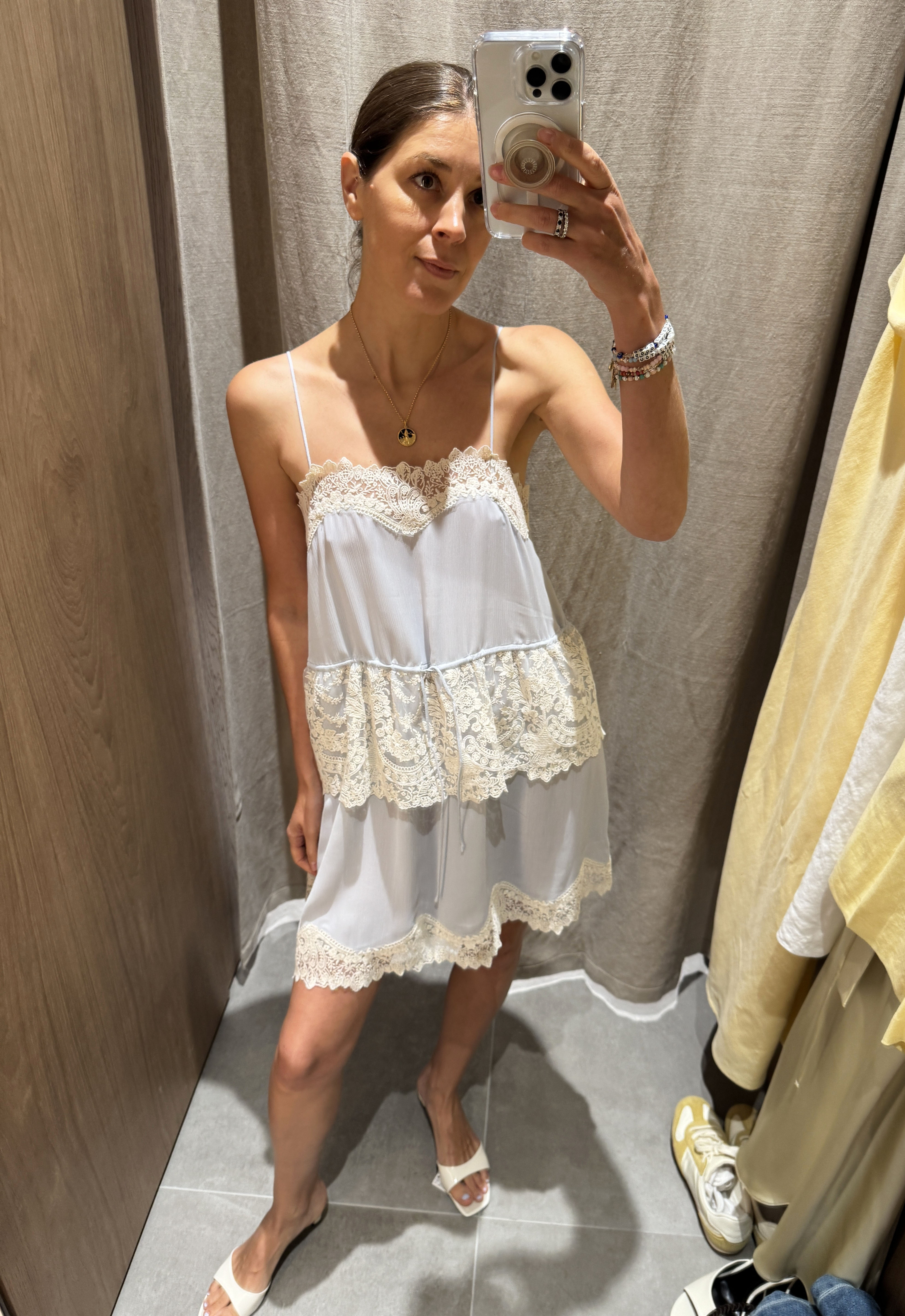 Woman in light blue and lace dress