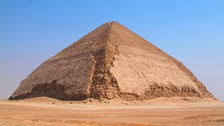 We see the Bent Pyramid against a blue sky.
