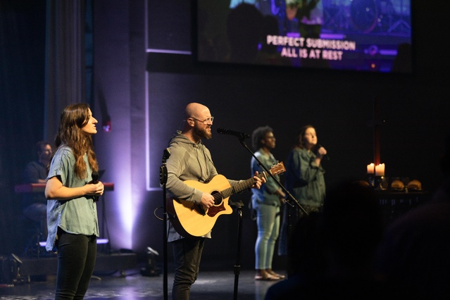 Guitarists rock out on stage at La Croix Church,