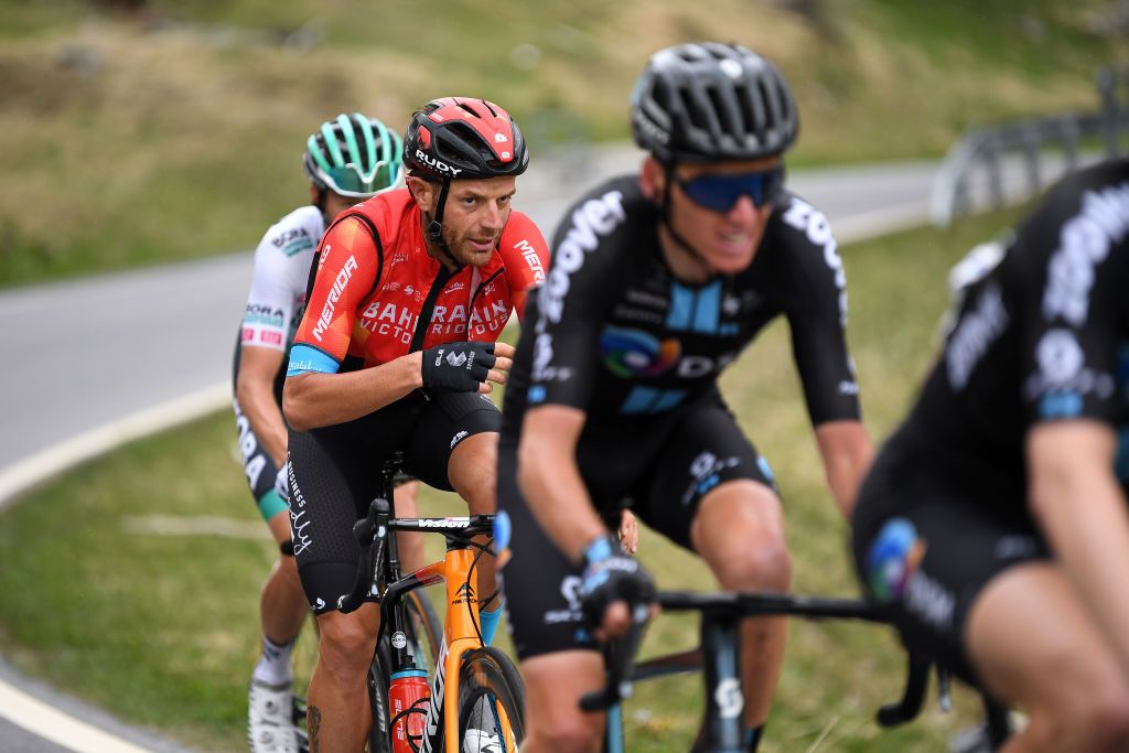 VALLE SPLUGA ALPE MOTTA ITALY MAY 29 Damiano Caruso of Italy and Team Bahrain Victorious in breakaway passing through Splgenpass Passo dello Spluga 2115m mountain landscape during the 104th Giro dItalia 2021 Stage 20 a 164km stage from Verbania to Valle Spluga Alpe Motta 1727m Snow UCIworldtour girodiitalia Giro on May 29 2021 in Valle Spluga Alpe Motta Italy Photo by Tim de WaeleGetty Images