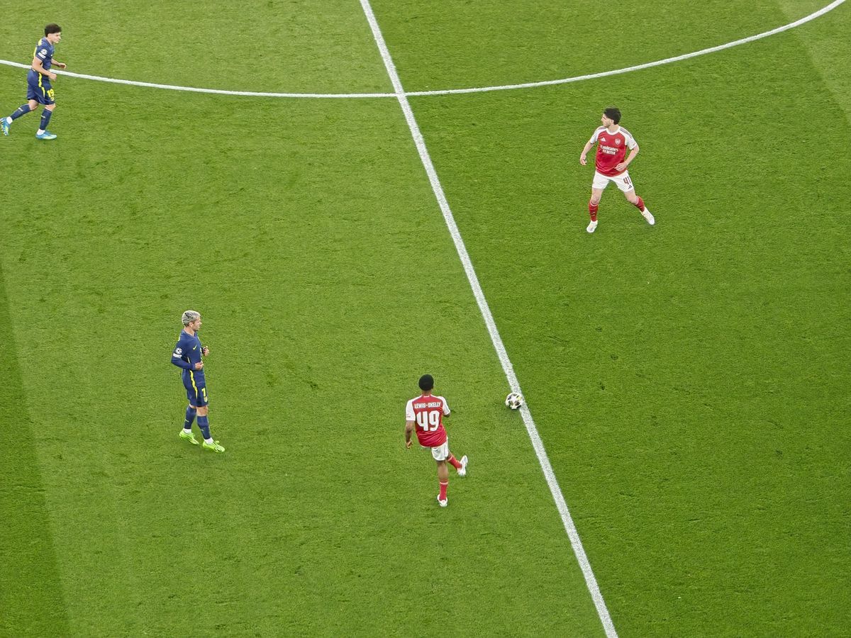 A Champions League soccer match between Arsenal and Atletico Madrid, as seen from the upper stand at the Emirates stadium, London. Zoomed in photos of the players