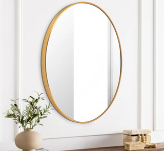 round gold mirror