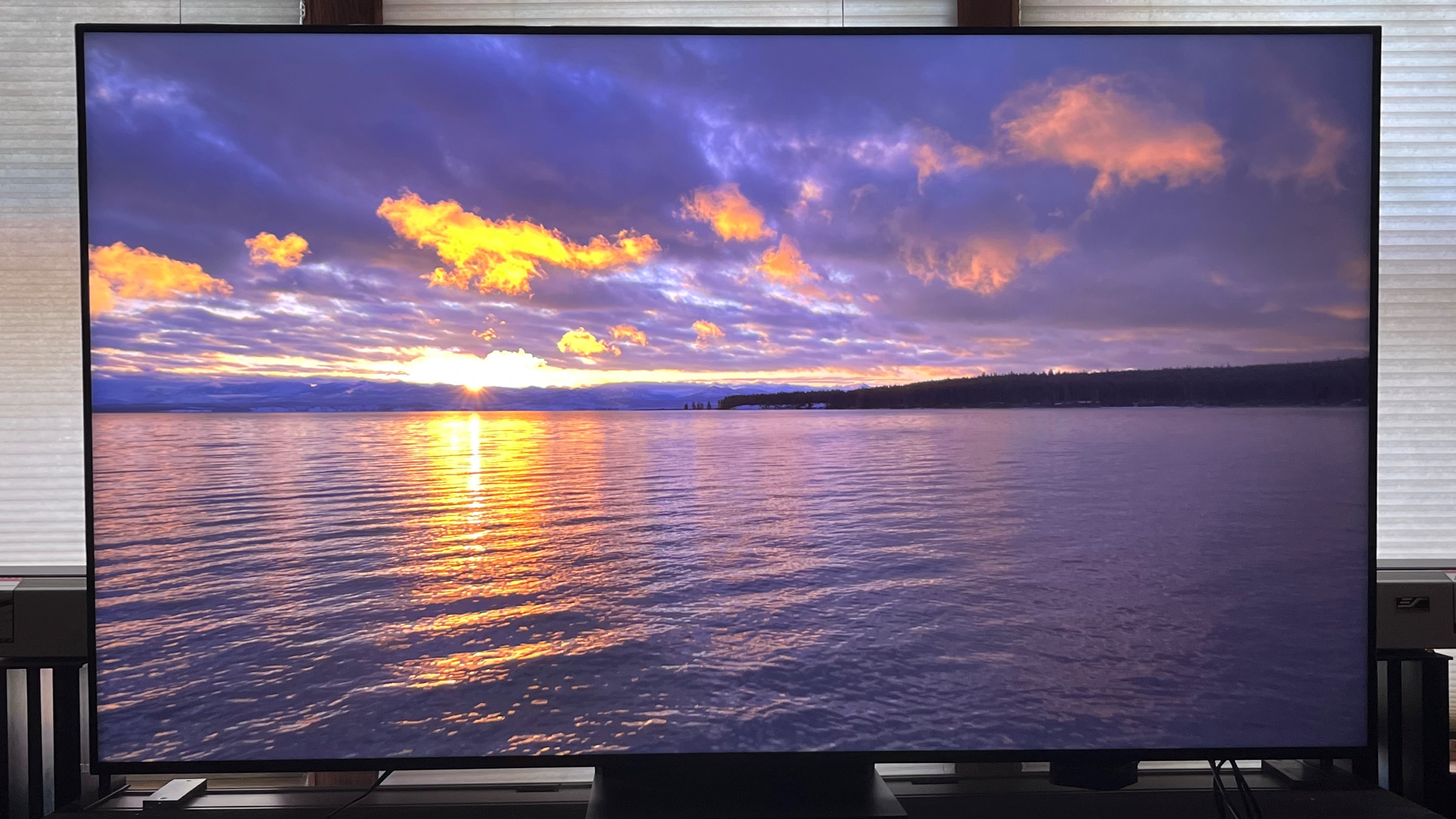 TCL QM8 showing image of sunset on water