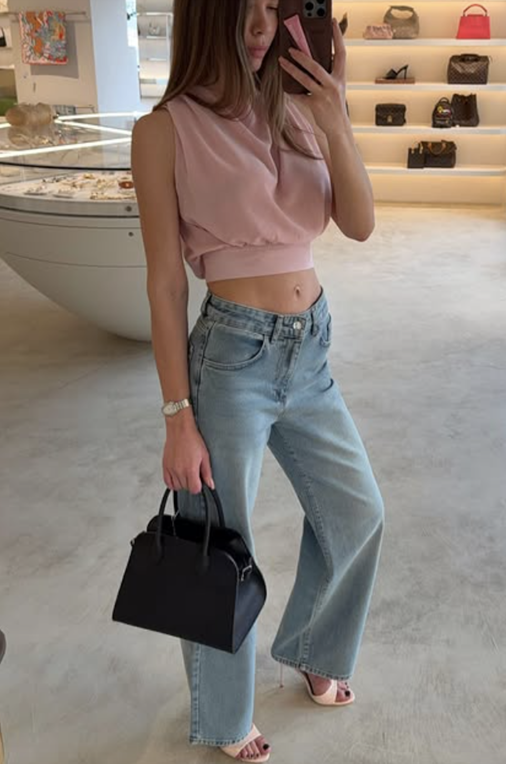 Woman wearing jeans with pointed peep-toe heels 2025.