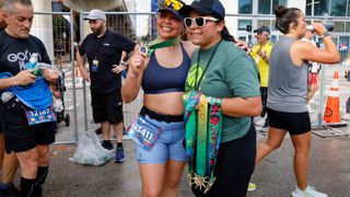 Runner receiving medal after 2024 Miami Marathon