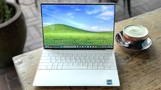 Dell XPS 13 Plus (2023) review unit on a coffee table running Windows 11