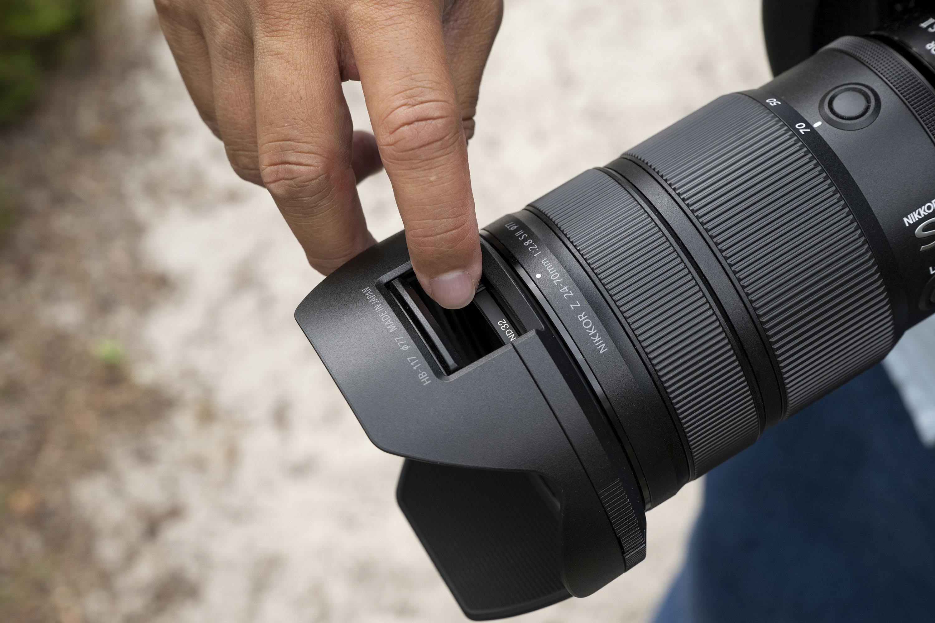 Nikon Z 24-70mm f/2.8 S II lens in the hand