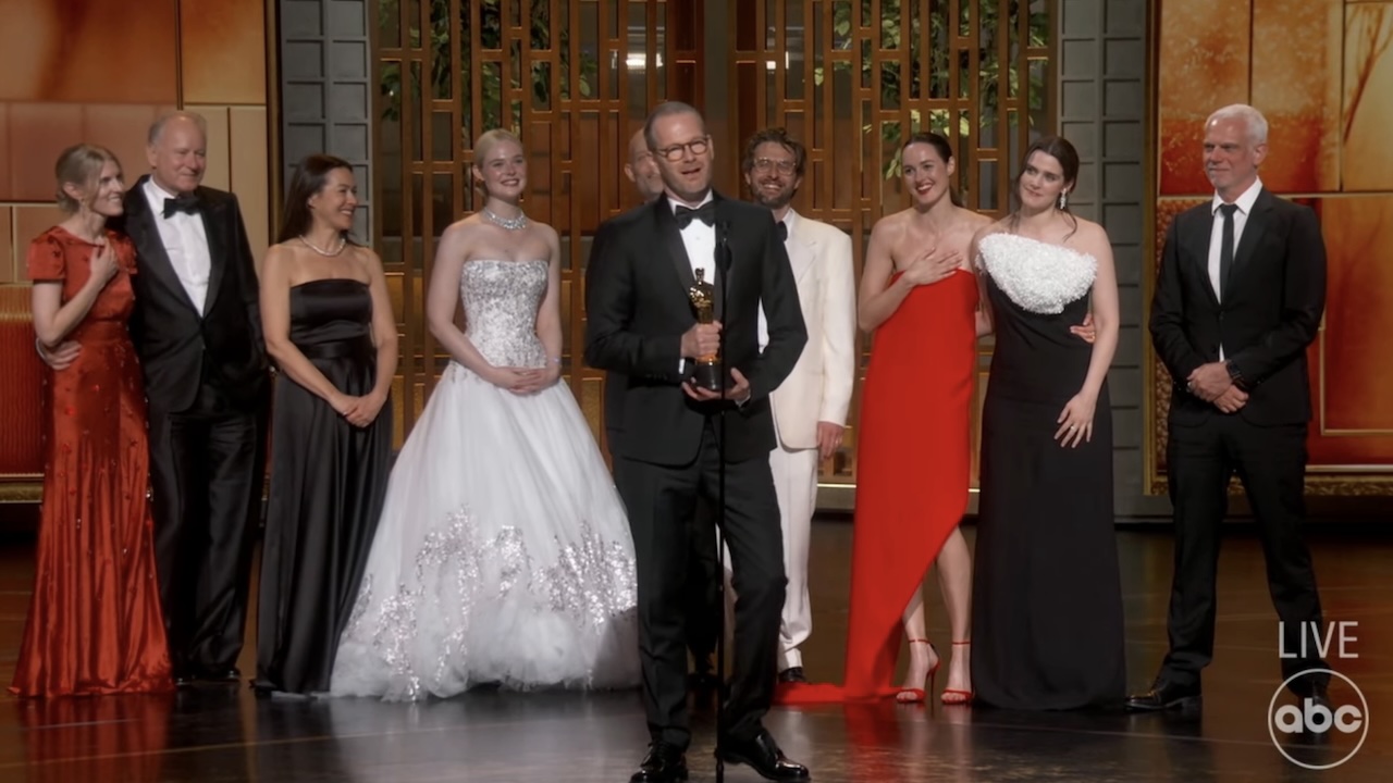 Sentimental cast and director on stage at Oscars