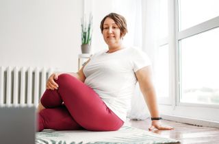 Woman practicing pilates at home