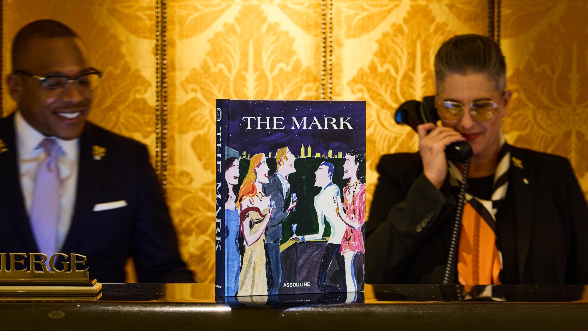 Two members of the concierge team behind a desk at The Mark