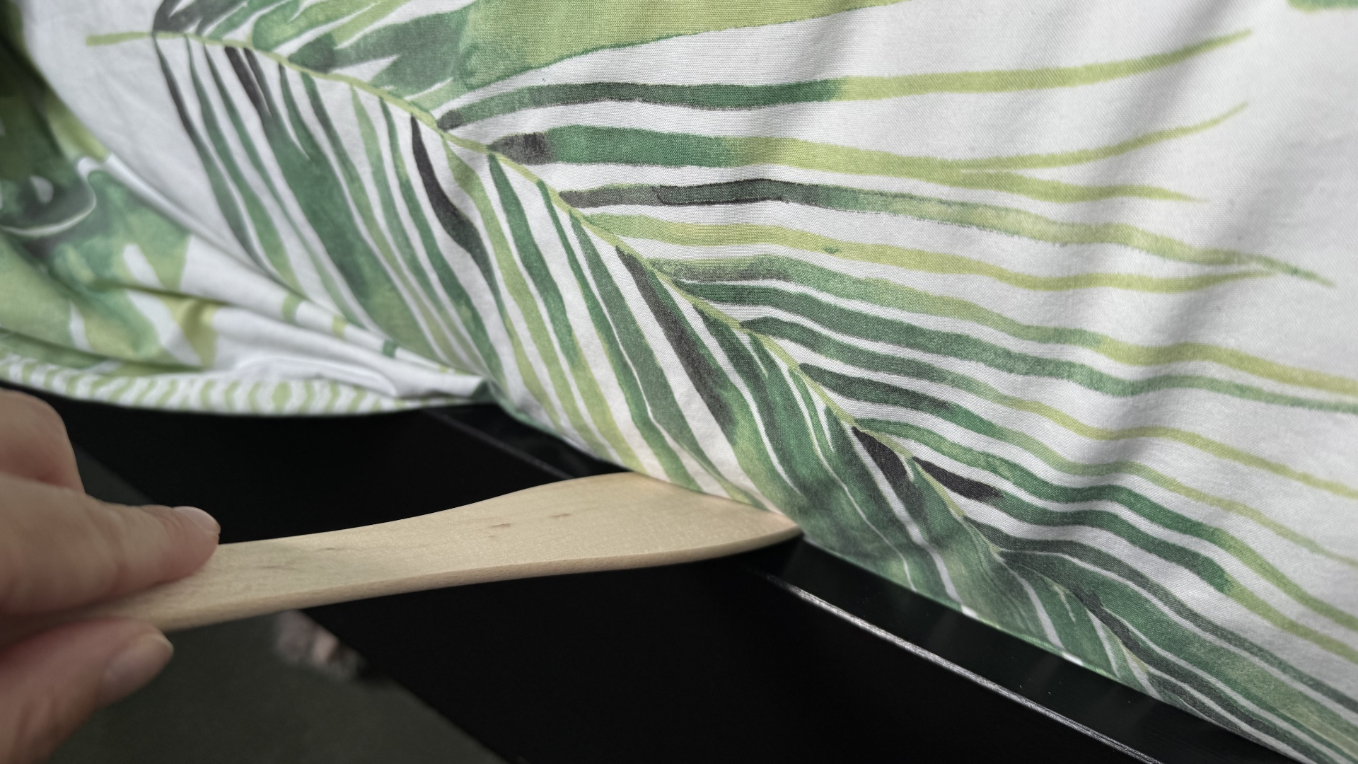 A spatula on a bed