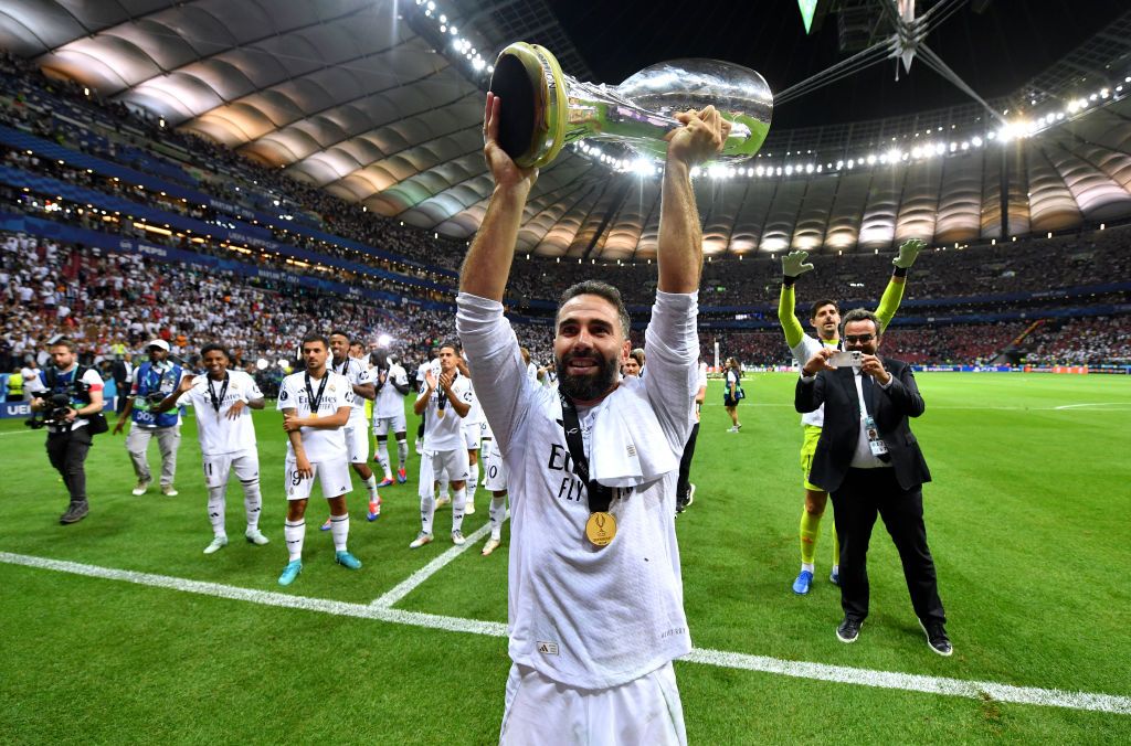 WARSAW, POLAND - AUGUST 14: Daniel Carvajal of Real Madrid celebrates with the UEFA Super Cup Trophy after his team&#039;s victory in the UEFA Super Cup 2024 match between Real Madrid and Atalanta BC at National Stadium on August 14, 2024 in Warsaw, Poland. (Photo by Valerio Pennicino - UEFA/UEFA via Getty Images)