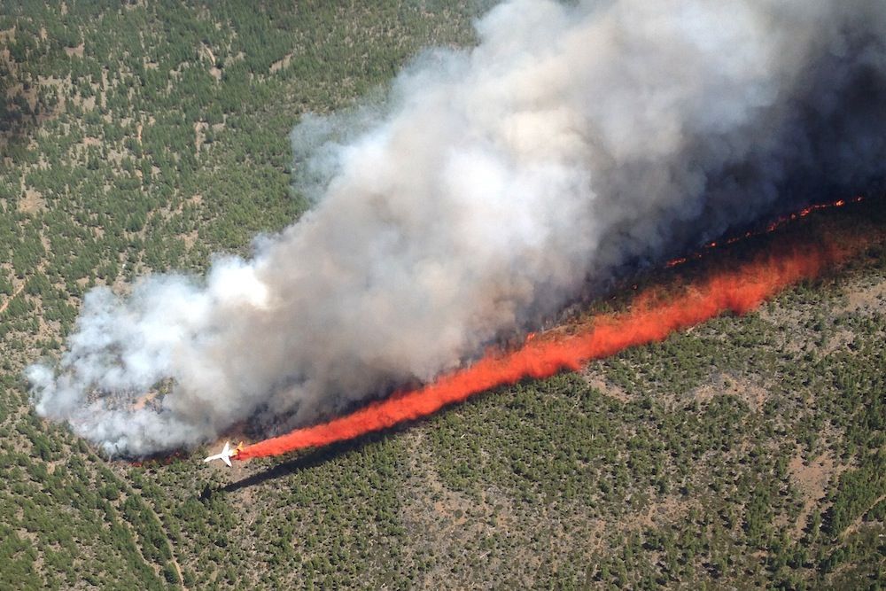 An MD-87 tanker fights a forest fire