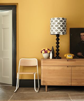 Yellow painted room with black accessorises