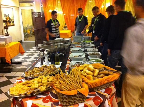 The Cannondale Factory Team riders help themselves to an Italian buffet.
