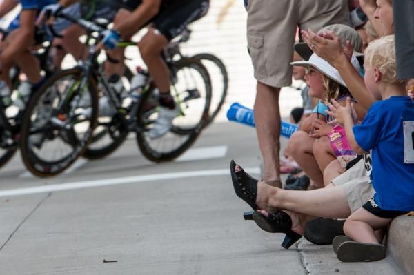 Young fans watch a big day of bike racing.