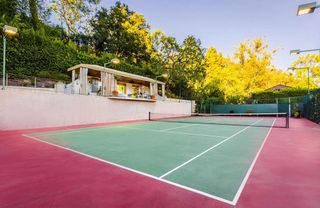 pink tennis court with lamps