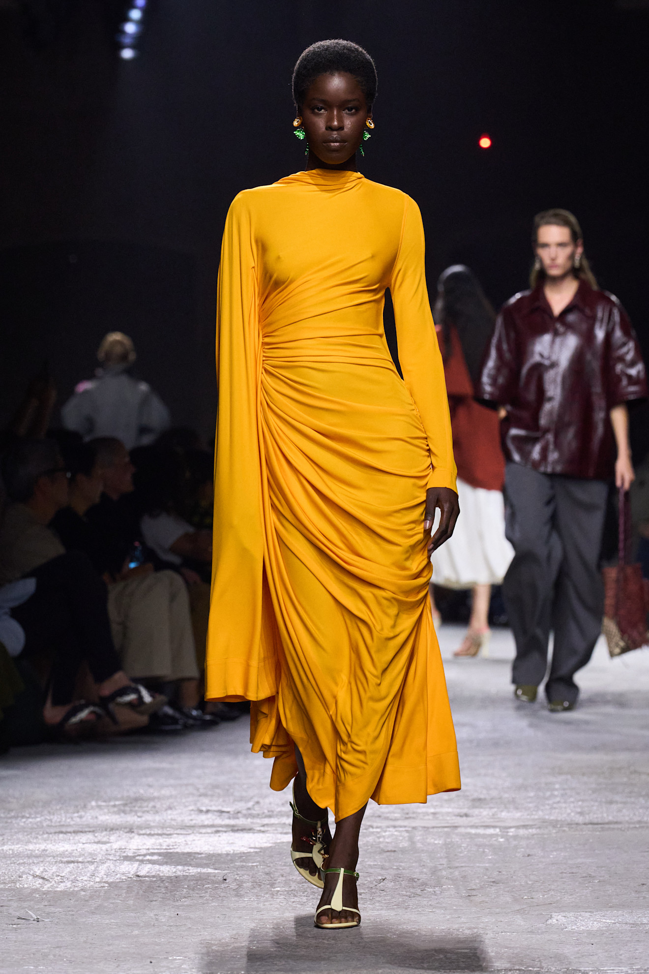A model wore turmeric yellow on the Bottega Veneta Spring 2025 runway