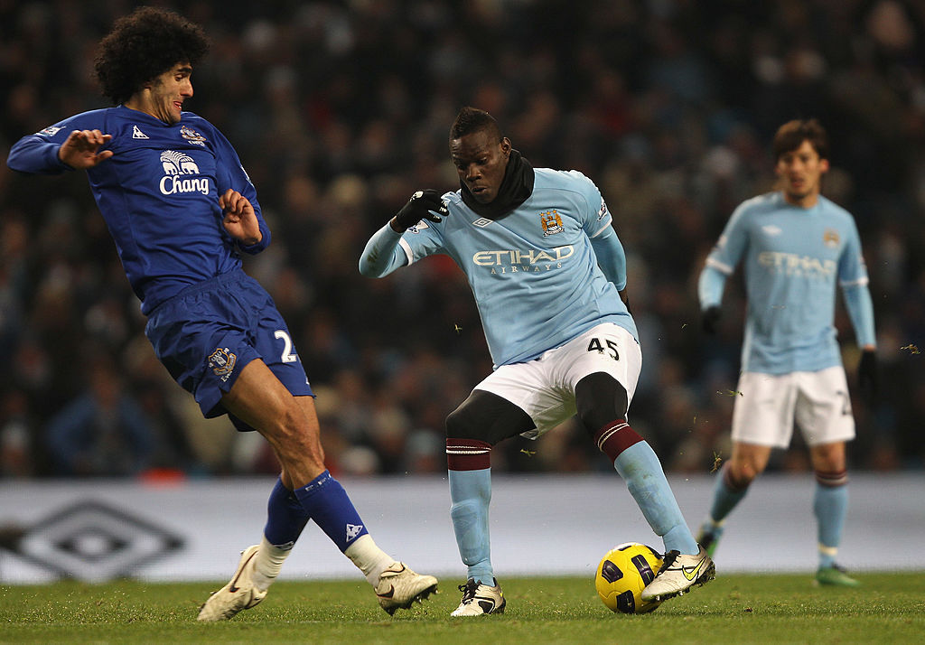Mario Balotelli in action for Manchester City in 2010, wearing a snood