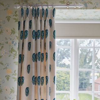 curtain rail floral bedroom