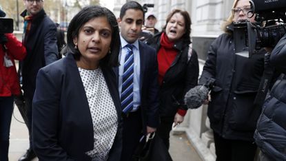 Rupa Huq surrounded by journalists