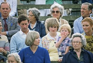 Prince Charles with Diana Spencer and Sarah Ferguson watching the polo at Cowdray Park. Photo by Tim Graham Photo Library via Getty Images.