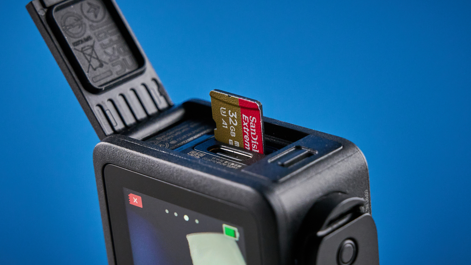 The GoPro LIT Hero against a blue background