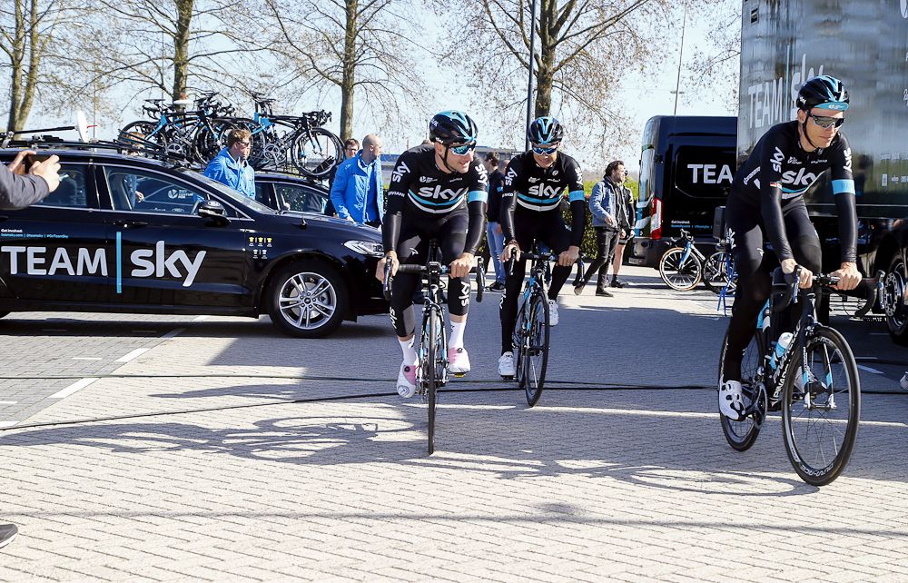 Team Sky riders start rolling.