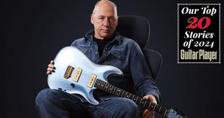 Mark Knopfler holds his 2011 Pensa Custom guitar