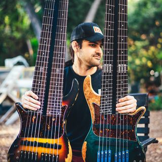 Felix Martin with two FM Guitars basses