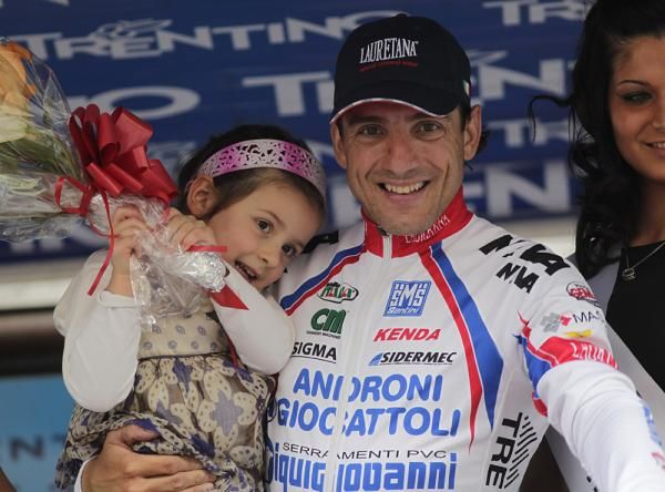 Alessandro Bertolini (Androni Giocattoli) shares his podium moment with his daughter