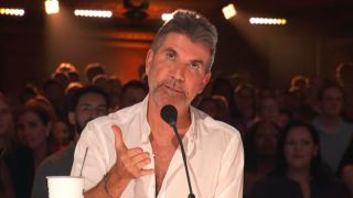 Simon Cowell speaking to eliminated performers in America's Got Talent Season 20's first live quarterfinal eliminations
