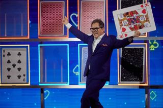 Alan Carr hosts Play Your Cards Right in the first episode of Epic Gameshow